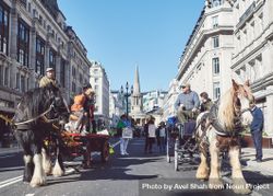 London, England, United Kingdom - March 19 2022: Two horse and buggy’s going through London 4MBzEb