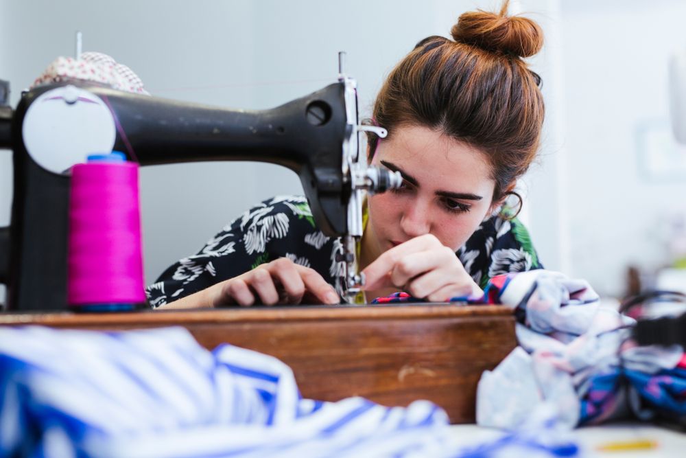 Woman in a sewing school