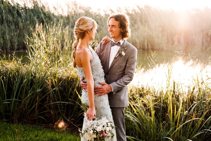 Happy newly wedded couple delighting in event at nature