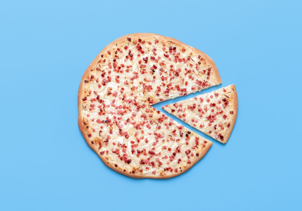 Tarte flambee above view on a blue background