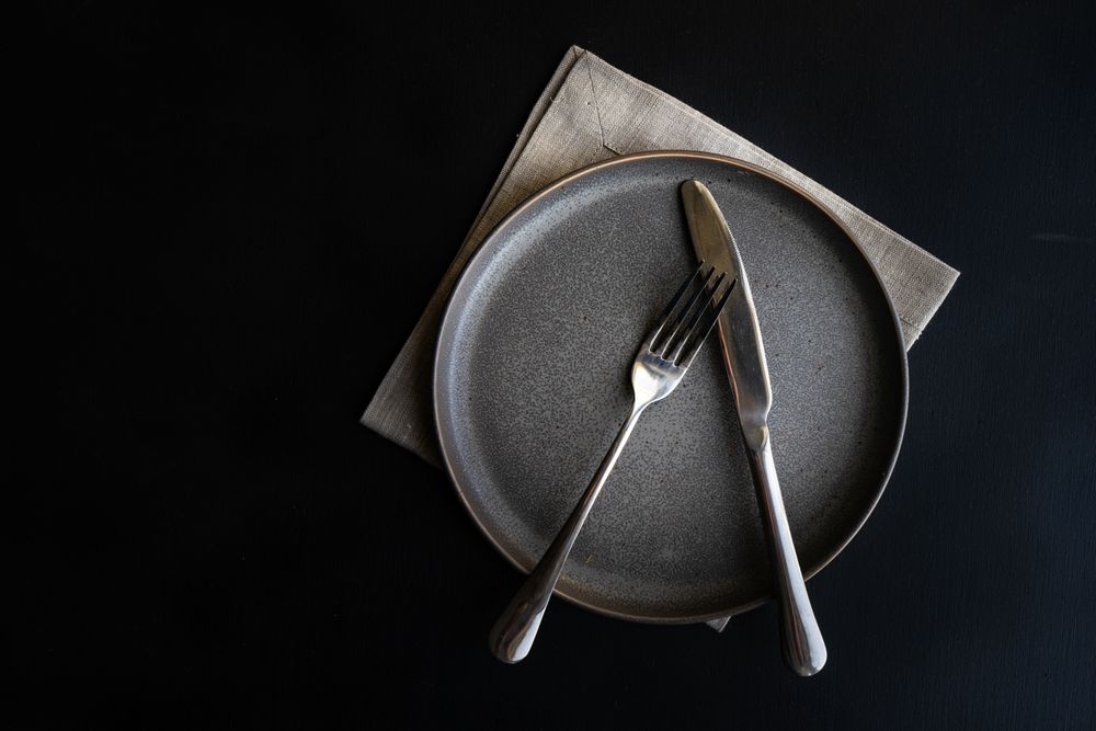 Top view of dark grey plate with space for text