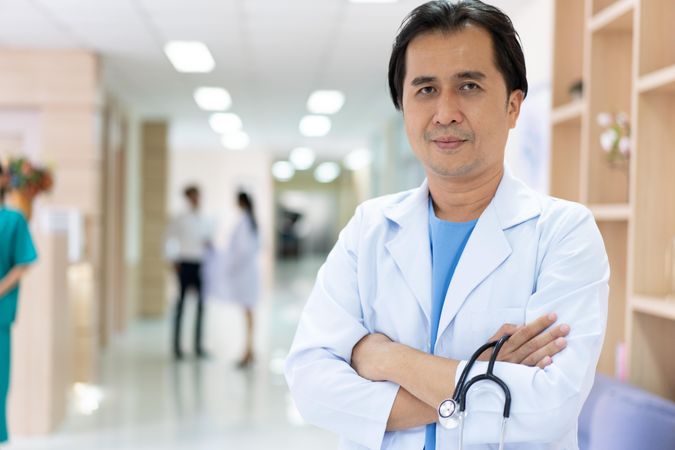 Asian doctor in hospital hallway