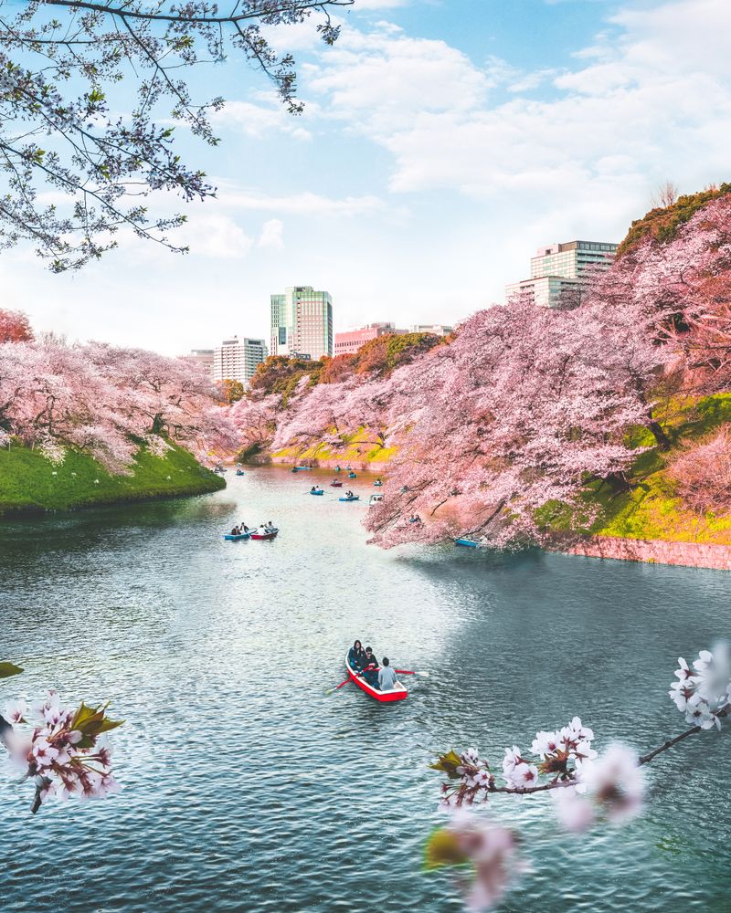 People on red boat on water in Tokyo, Japan