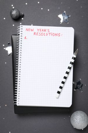 Concept of New Year Resolutions list, new year goals, top view