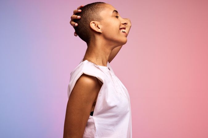 Side view of a carefree woman with shaved head