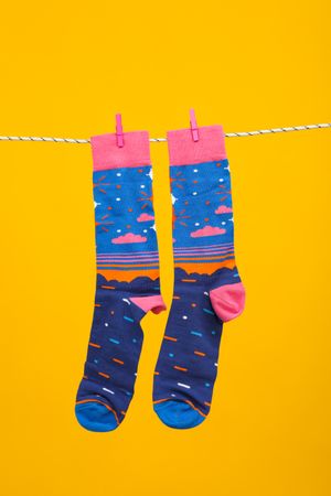 Concept of clothes for legs - socks, socks hanging on rope