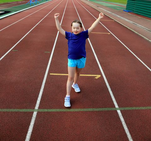 Accomplished girl finishing race