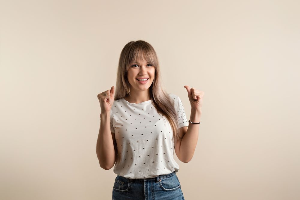 woman posing in pastel background