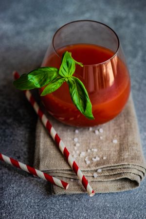 Fresh tomato juice with basil garnish