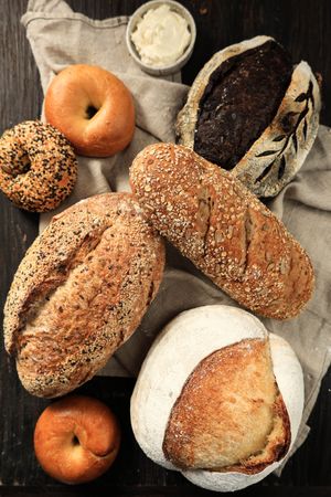 Homemade Fresh Baked Various Loafs of Wheat and Rye Sourdough Bread Flat Lay.