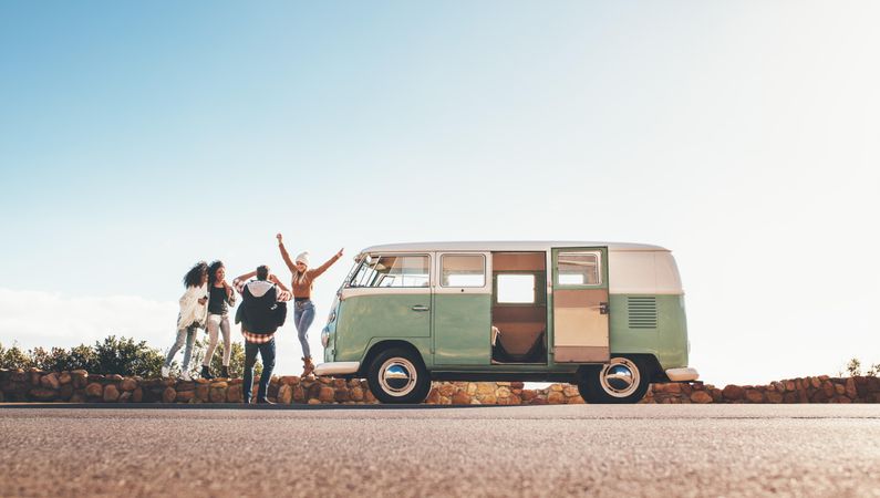 Group of man and women on road trip together