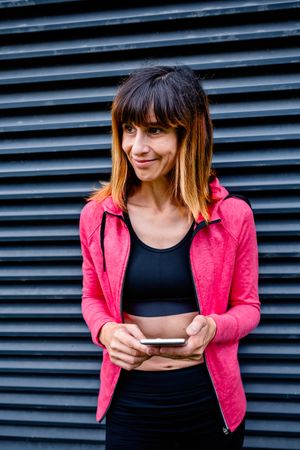 Female athlete with mobile phone