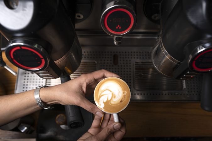 Barista using coffee machine