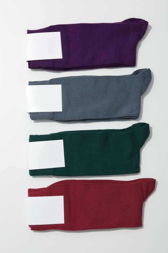 Multicolored high socks on a light background.