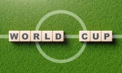 Top view of soccer field with the words “World Cup”