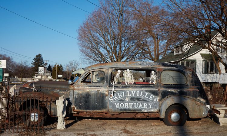 Old hearse and halloween skeletons, Benton Harbor, Michigan
