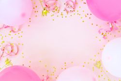 Pink birthday balloons framing a pink background