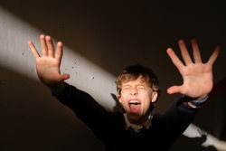 Excited boy screaming and reacting on sudden bright light