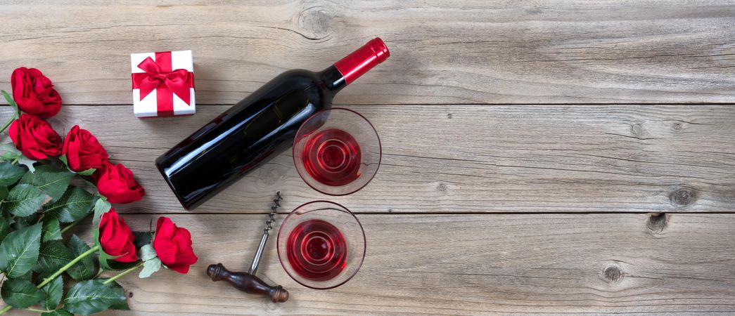 Red wine for Valentine’s date on rustic wood
