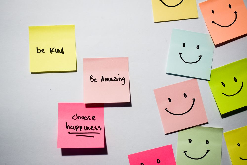 Be kind, Be Amazing, Choose happiness with smile emoticon on sticky notes