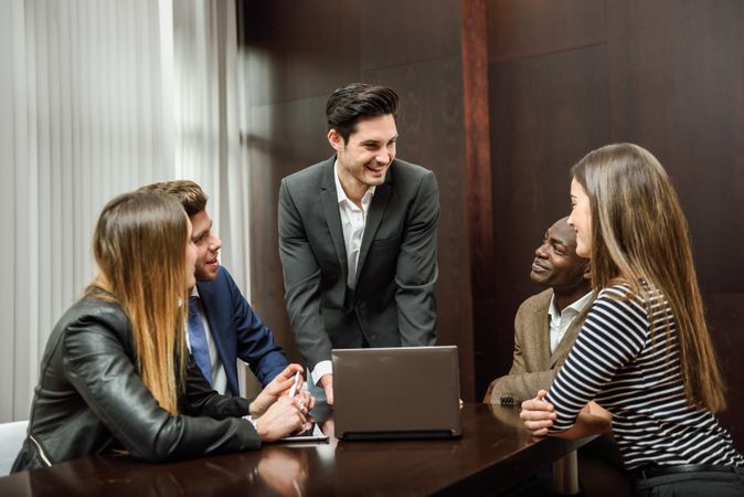 White businessman leading a brainstorming sessions with his co workers