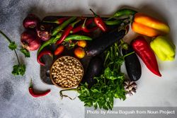 Fresh vegetables and beans on wooden board with copy space 56GxQj