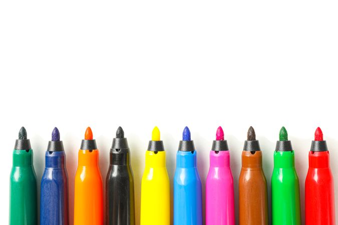 Color markers isolated on blank background, closeup