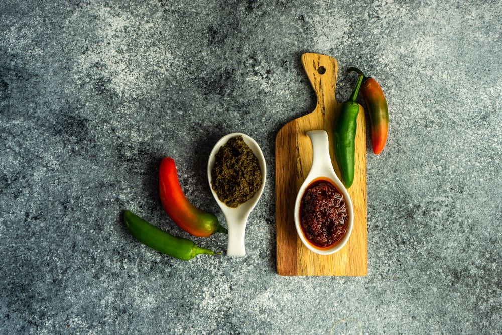 Top view of two servings of Georgian sauce Adjika