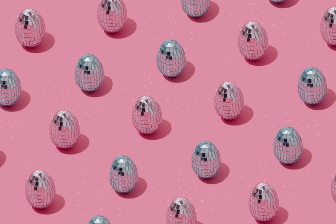 Disco ball Easter eggs pattern in pink and blue pastel colors