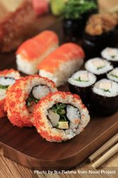Colorful California rolls on wooden tray 5kyEob