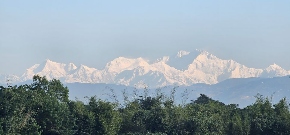 Snow Capped Mountains with Green Forest