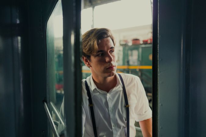 Traveler looking out train window