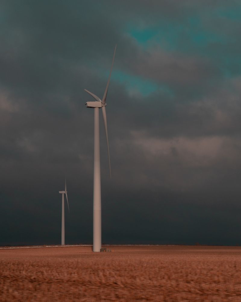 Wind turbine under gray clouds