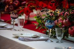 Close up of crystal wine glass at elegant formal dinner table