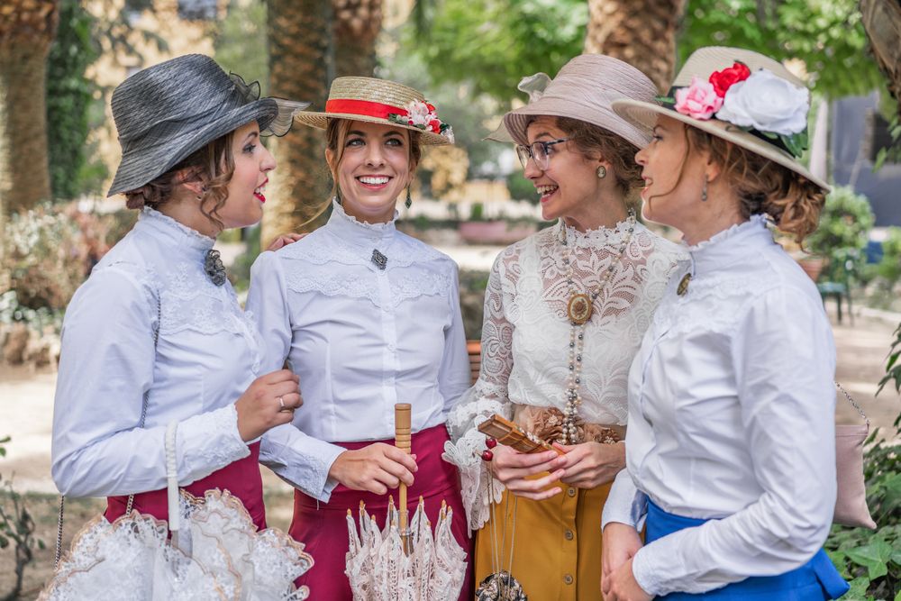 Vintage female friends speaking in garden