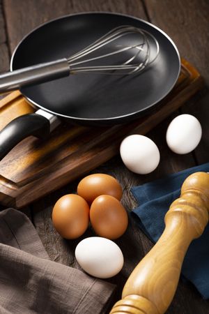 Chicken eggs go up on the table.