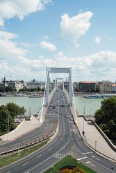 Roads leading to big steel bridge above river