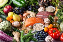 Flat lay of fresh vegetables, fruit and fish