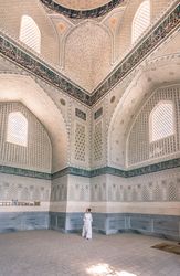 Unrecognizable tourist inside ancient building