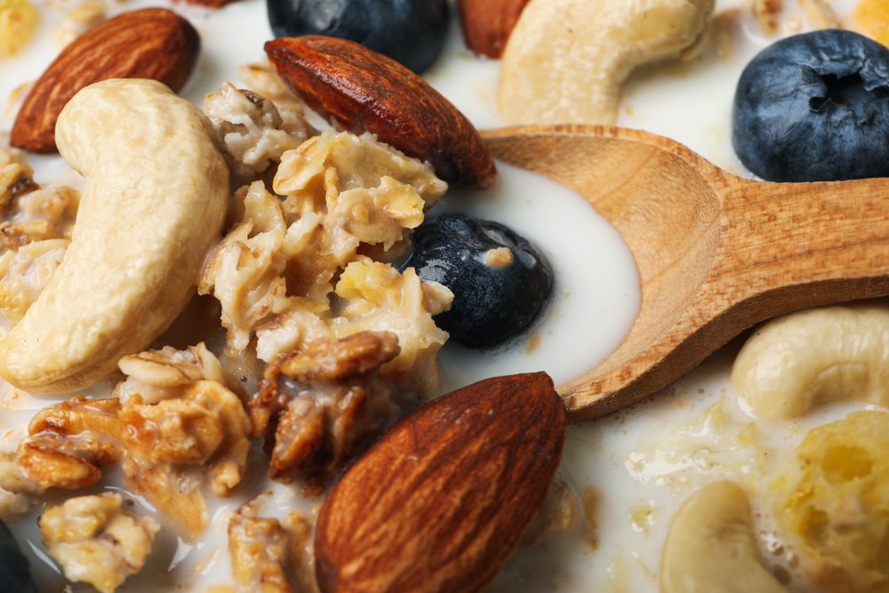 Tasty and nutritious breakfast concept - muesli with yogurt