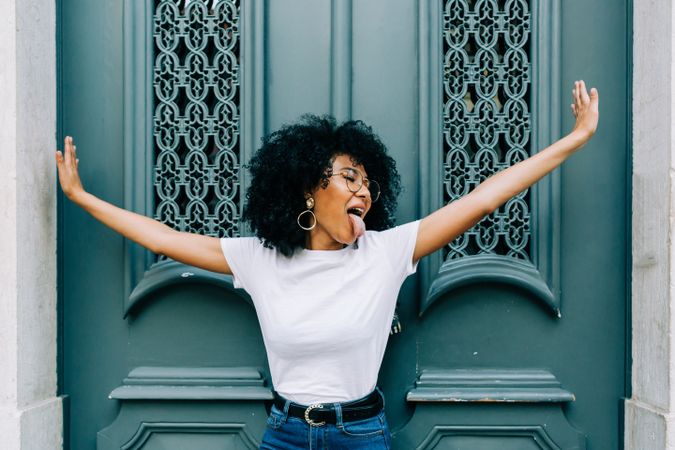 Stylish Black female with outstretched arms