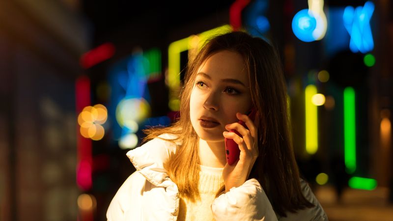 Woman enjoying nightlife in city