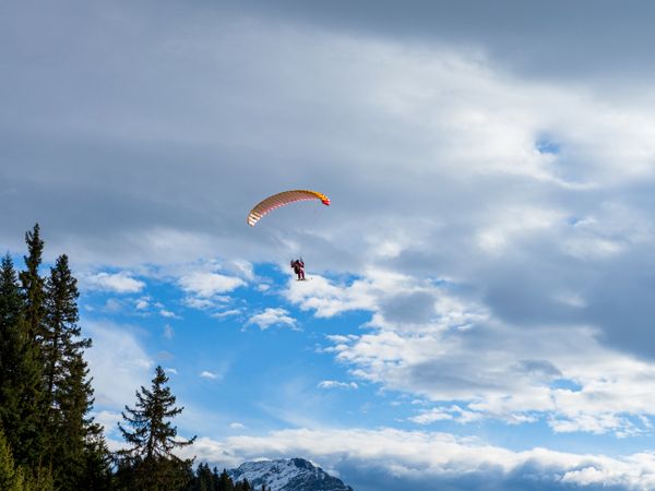 Paragliding skier, extreme sport, flying and gliding.