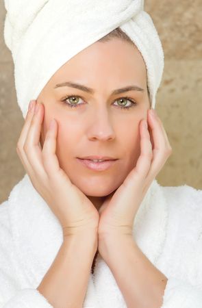 Portrait of woman with a white bathrobe