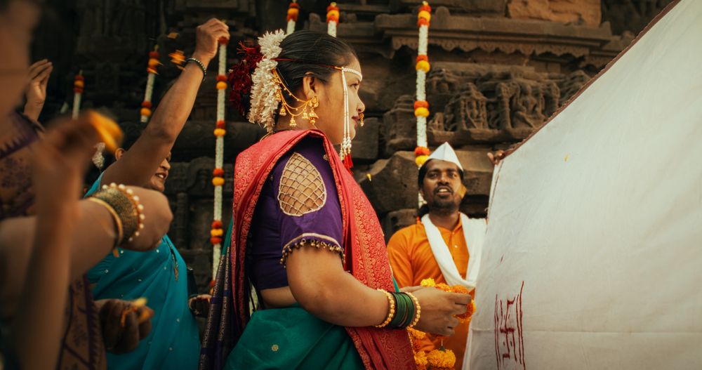 Authentic Slow-Motion Footage of Traditional Indian Wedding Customs: Groom and Bride Being Celebrated by Happy Friends and Family Throwing Flowers, Singing