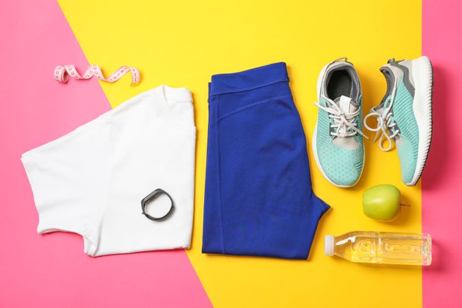 Flat lay composition with healthy lifestyle accessories on color background