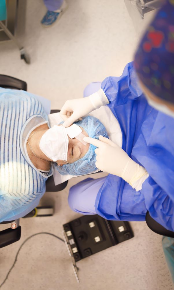 Looking down at mature woman in cataract surgery