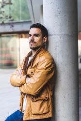 Stylish man outside modern building