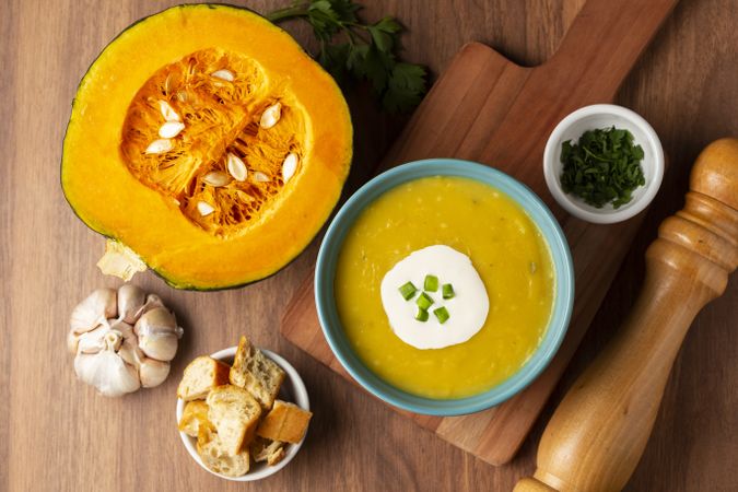 Bowl with pumpkin soup on the table.