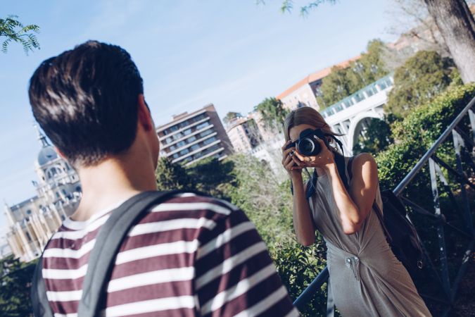 Happy young couple taking selfie in park